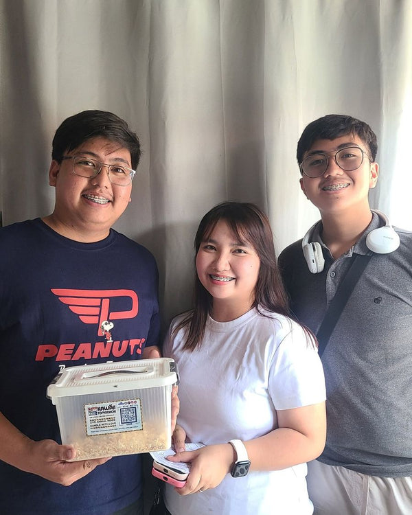 Three friends with their new hamster