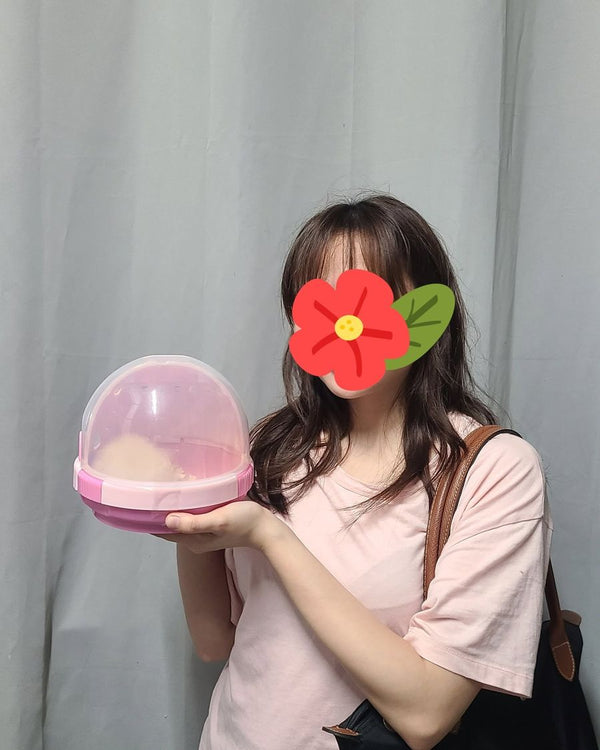 A customer with a pink hamster carrier