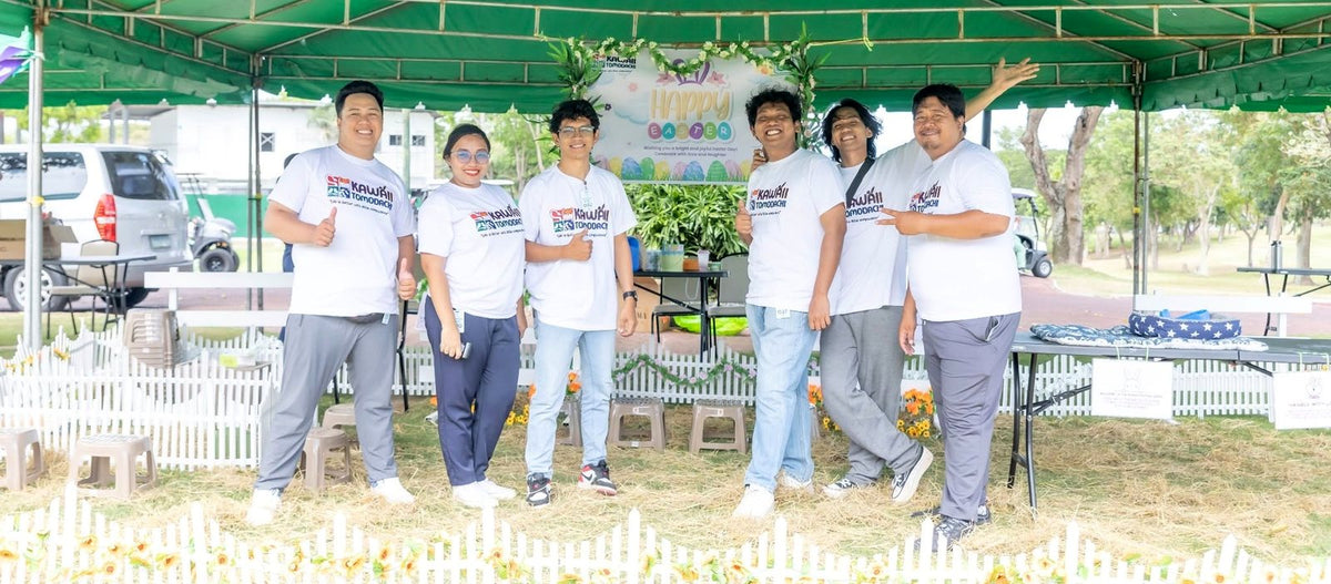 The Kawaii Tomodachi team in matching shirts at an Easter petting zoo